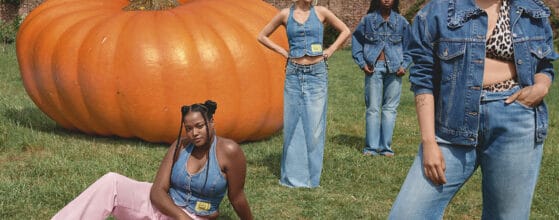 GANNI x Levi's models pose in front of giant pumpkin.